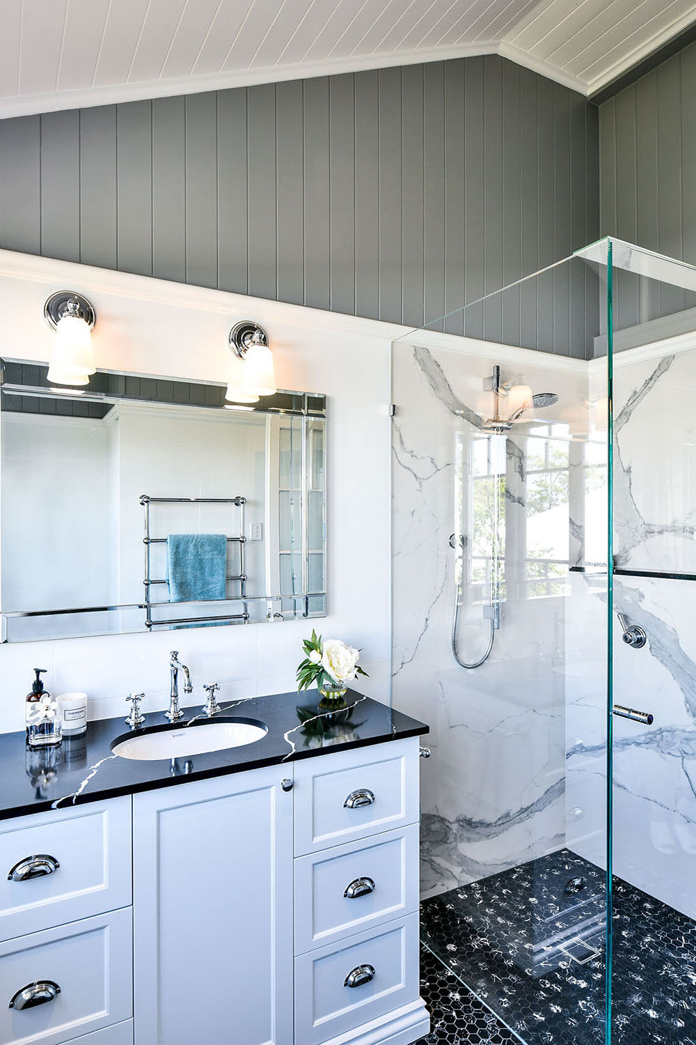 white and black bathroom with marble tops