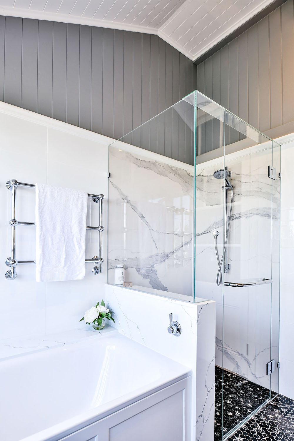 white and black bathroom with marble shower